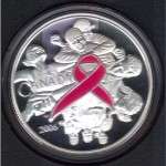 2006 Breast Cancer Silver Coin with colored pink ribbon.