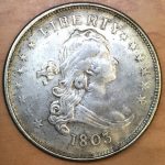 Historic, genuine 1803 Draped Bust design U.S. silver dollars in Very Fine condition are currently valued at about $3,000.  This counterfeit 1803-dated dollar was recently offered in a Hong Kong flea market for less than $3.
