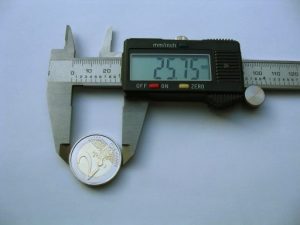 Digital caliper measuring a €2 coin.