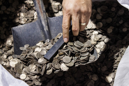 Hong Kong-based Wealthy Max Ltd. publicly opened and sampled 13 tonnes of mutilated U.S. coins waiting for shipment in Hong Kong.