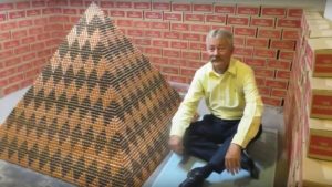 Cory Nelson and his coin pyramid